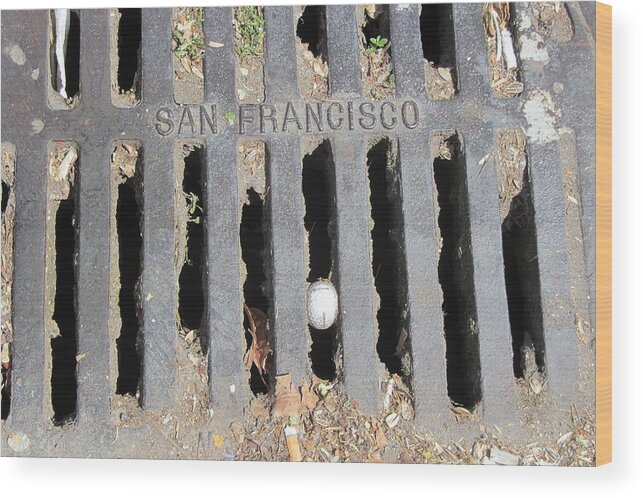 Golfball Wood Print featuring the photograph golfball in SF gutter by Erik Burg