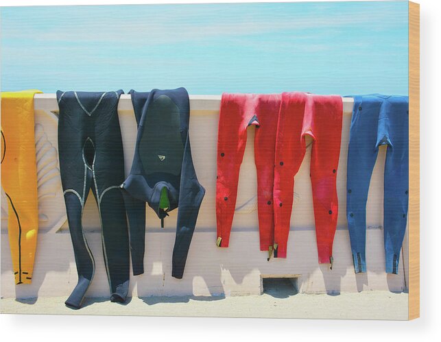Wetsuits Surfer Colorful Beach Wall Sea Blue Sky Red Yellow Sport Water Ocean Waves Human Form Wood Print featuring the photograph Hang Ten by Jennifer Wright