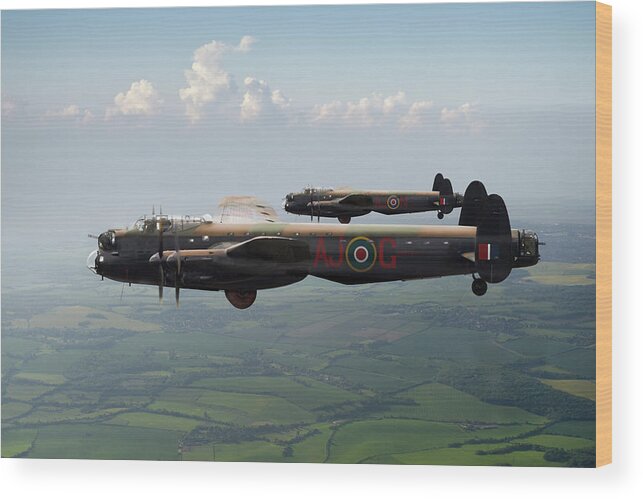 617 Squadron Wood Print featuring the photograph Lancasters AJ-G and AJ-N carrying Upkeeps by Gary Eason