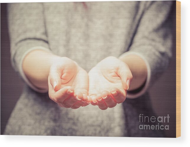 Hands Wood Print featuring the photograph Light in young woman's hands by Michal Bednarek