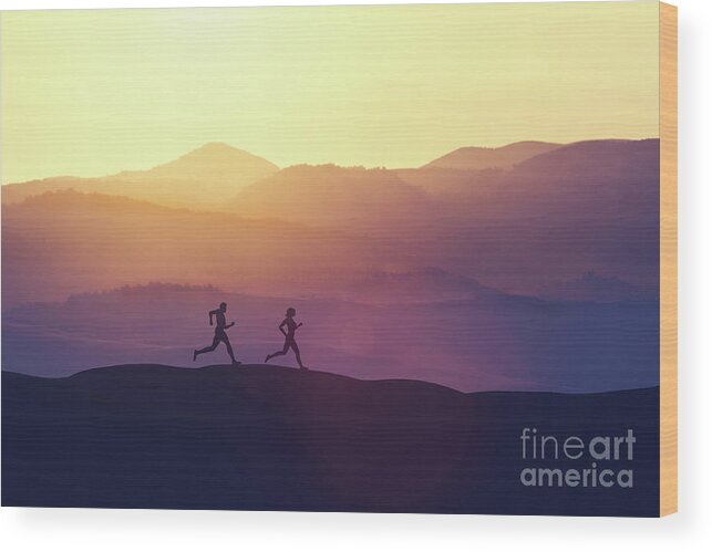 Man Wood Print featuring the photograph Man and woman running on a hill in the country by Michal Bednarek