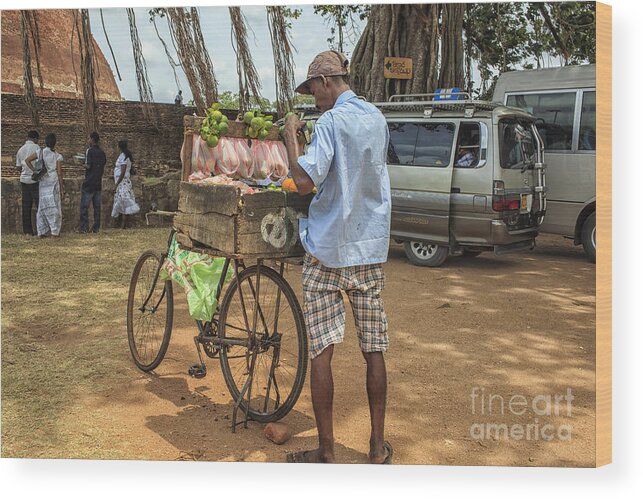Sri Lanka Wood Print featuring the photograph Man selling citrus fruit by Patricia Hofmeester
