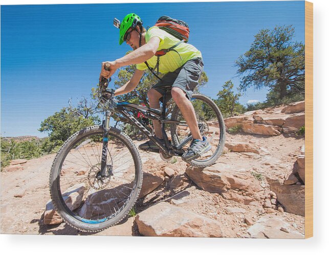 Success Wood Print featuring the photograph Mountain biker on the Porcupine Rim Trail near Moab by Elijah Weber