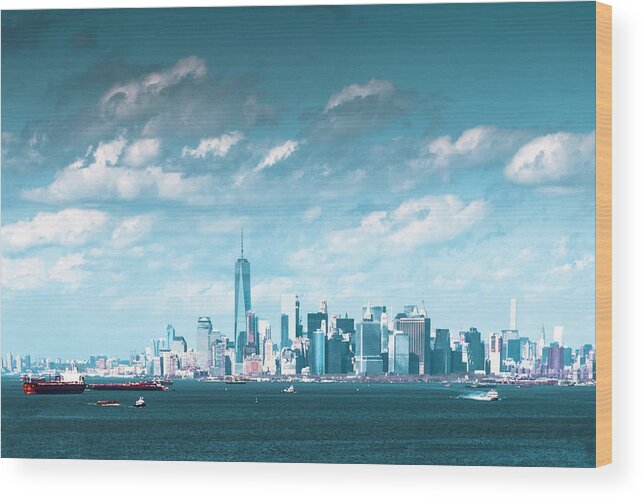Manhattan Skyline Wood Print featuring the photograph New York City Harbor with clouds by Kenneth Cole