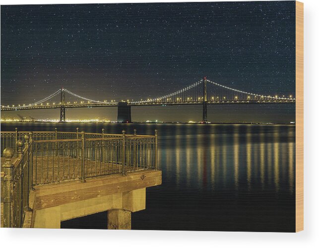San Francisco Wood Print featuring the photograph Oakland Bay Bridge by the Pier in San Francisco at Night by David Gn