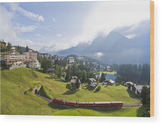 Townscape Wood Print featuring the photograph Rhaetian Railway in Arosa by Werner Dieterich