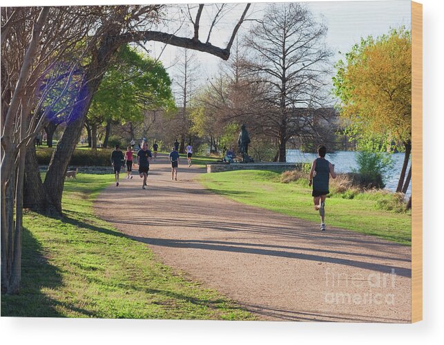 Stevie Ray Vaughan Statue Wood Print featuring the photograph Runners and joggers on the hike and bike trail town lake Austin Texas by Dan Herron