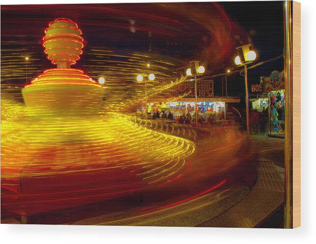 Luna Park Wood Print featuring the photograph Spinning until you're dizzy by Wolfgang Stocker