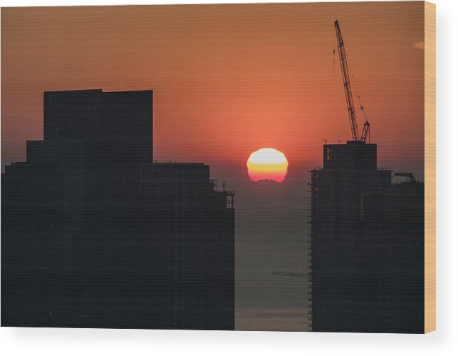 Seattle Wood Print featuring the photograph Sun setting over Seattle construction city by Matt McDonald
