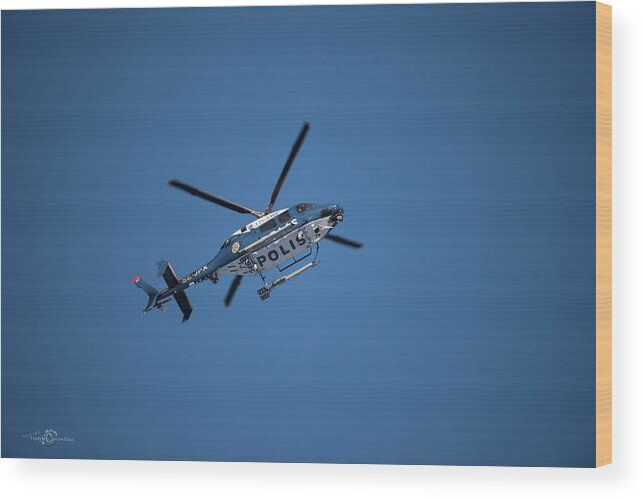 Swedish Police Helicopter Wood Print featuring the photograph The searcher in the air by Torbjorn Swenelius