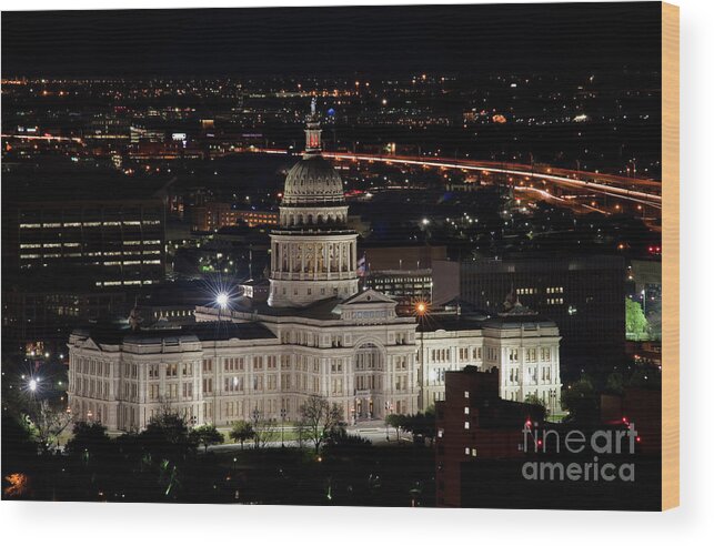 Austin Wood Print featuring the photograph The Texas State Capitol at night as rush hour traffic lights str by Dan Herron