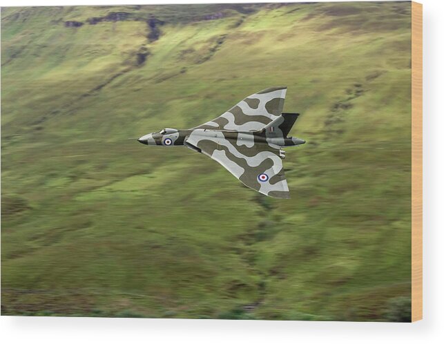 Avro Vulcan Wood Print featuring the photograph Vulcan B2 low-level against hillside by Gary Eason
