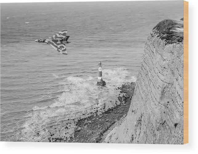 Avro Vulcan Wood Print featuring the photograph Vulcan passing Beachy Head BW version by Gary Eason