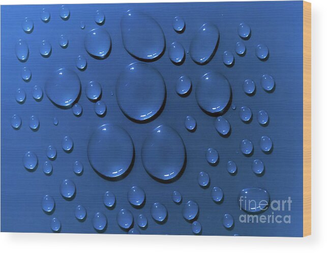 Water Wood Print featuring the photograph Water drops pattern on blue background by Simon Bratt
