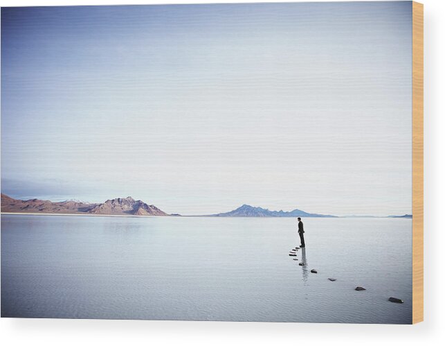Tranquility Wood Print featuring the photograph Businessman Standing At The End Of #1 by Thomas Barwick