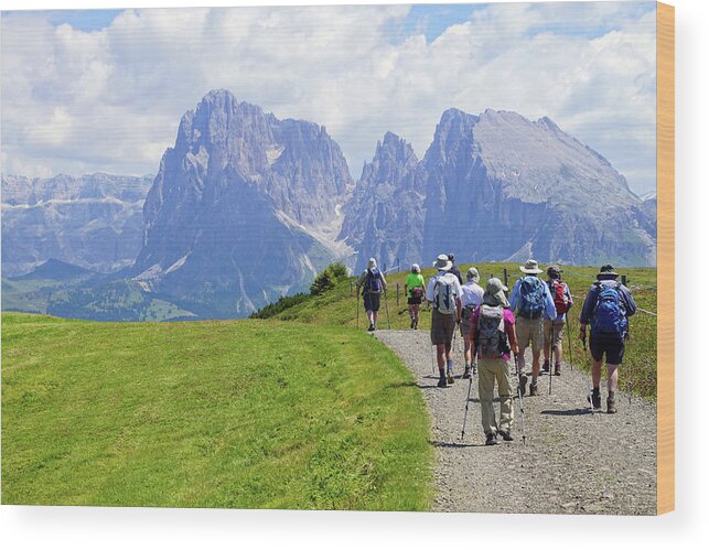 Italy Wood Print featuring the photograph Hikers walking towards the Langkofel #1 by Steve Estvanik