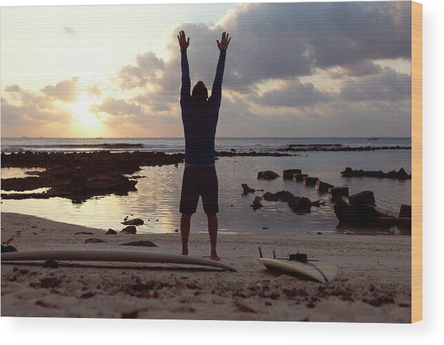 Adults Wood Print featuring the photograph Male Surfer Practising Yoga At The Beach #1 by Cavan Images / Konstantin Trubavin