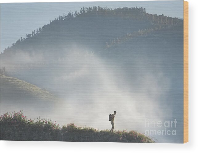 Tranquility Wood Print featuring the photograph Man Hiking In Mountains Against Cloud #1 by Stanislaw Pytel
