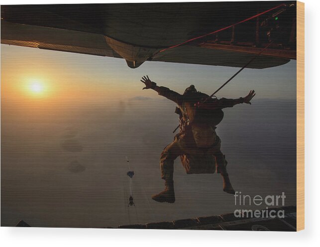 People Wood Print featuring the photograph A U.s. Air Force Pararescueman Jumps #3 by Stocktrek Images