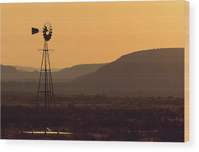 Tranquility Wood Print featuring the photograph A Desert Windmill At Sunset by Wesley Hitt