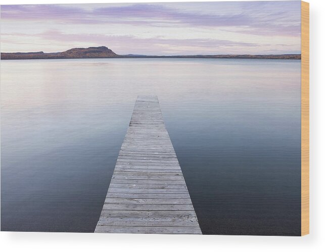 Tranquility Wood Print featuring the photograph A Dock In Lake Superior At Sunset by Susan Dykstra / Design Pics