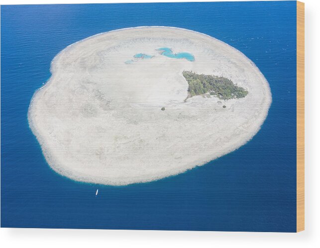 Landscapeaerial Wood Print featuring the photograph A Pinisi Schooner Drifts by Ethan Daniels