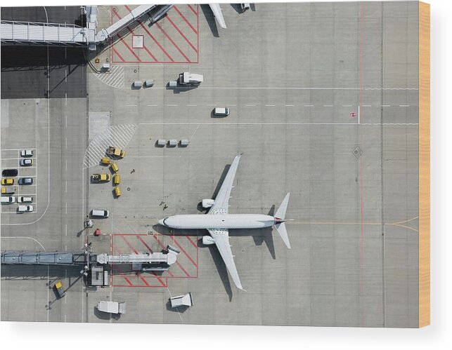 Passenger Boarding Bridge Wood Print featuring the photograph Aerial View Of Airplane by Fstop Images - Stephan Zirwes
