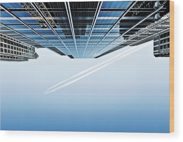 Clear Sky Wood Print featuring the photograph Aeroplane And Skyscrapers From Below by Caroline Purser