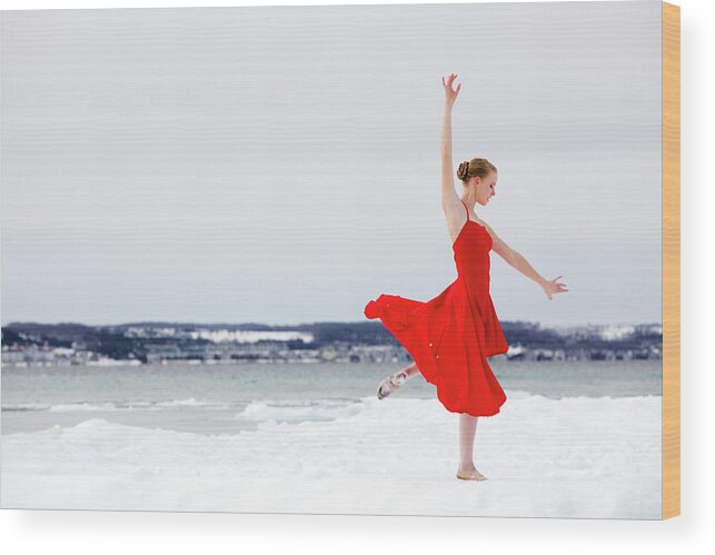 Ballet Dancer Wood Print featuring the photograph Ballerina Dances On Snow Covered Beach by Cbarnesphotography