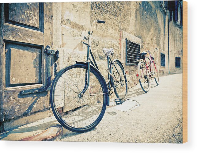 1950-1959 Wood Print featuring the photograph Bicycle Leaning Against Wall by Mauro grigollo