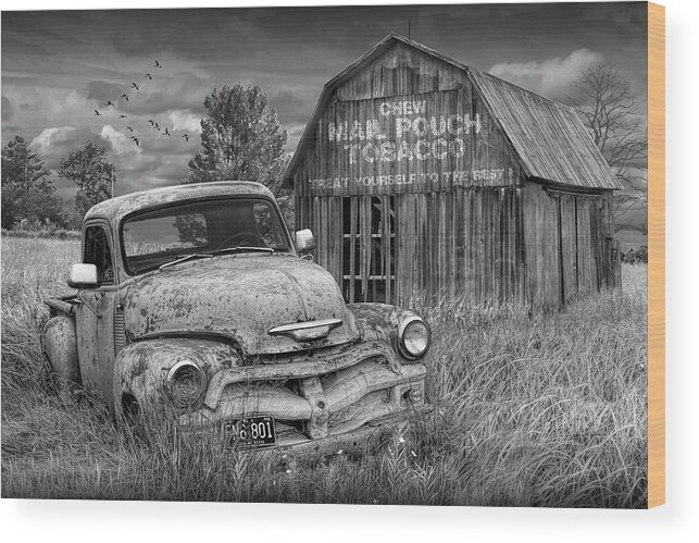 Chevy Wood Print featuring the photograph Black and White of Rusted Chevy Pickup Truck in a Rural Landscape by a Mail Pouch Tobacco Barn by Randall Nyhof