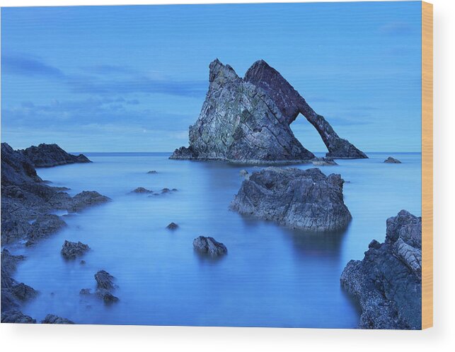 Water's Edge Wood Print featuring the photograph Bow Fiddle Rock, Natural Arch On Moray by Sara winter