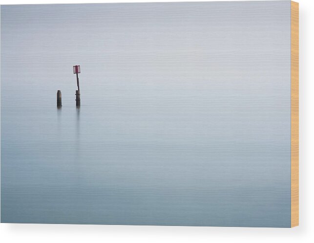 Tranquility Wood Print featuring the photograph Calm Sea With Post by Jeremy Vickers Photography