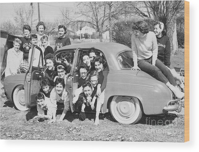 1950-1959 Wood Print featuring the photograph Car Packing Sorority Girls by Bettmann