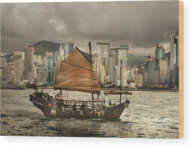 Sailboat Wood Print featuring the photograph China, Hong Kong, Junk Boat In Bay by Maremagnum