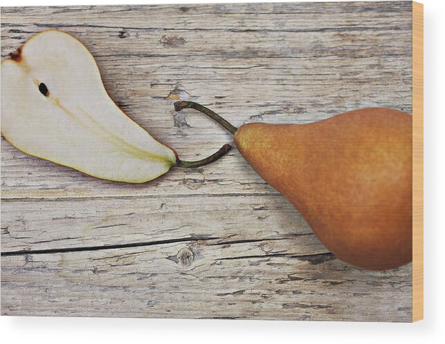 Two Objects Wood Print featuring the photograph Close Up Of Pear And Pear Slice On by Tom Merton