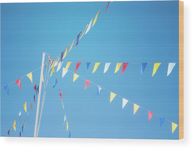 Pole Wood Print featuring the photograph Colorful Flags Above Blue Sky by Marta Nardini