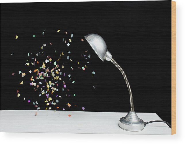 Event Wood Print featuring the photograph Confetti Floating Next To A Table Lamp by Benne Ochs