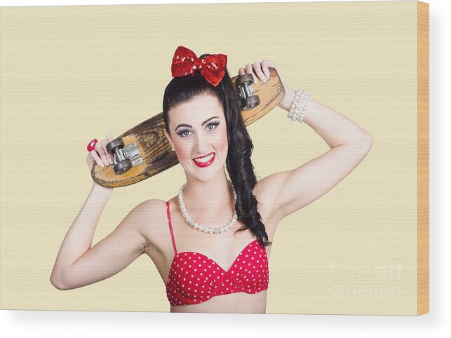 Skateboarding Wood Print featuring the photograph Cute pinup skater girl in punk glam fashion by Jorgo Photography