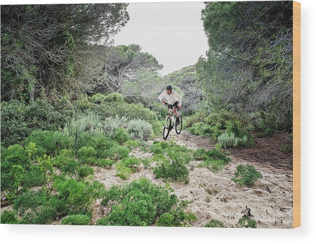 Sports Helmet Wood Print featuring the photograph Cycling Over Rugged Terrain by Ben Welsh / Design Pics