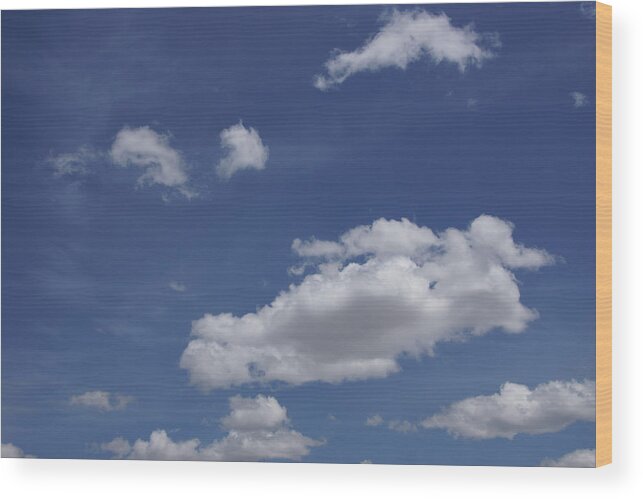 Deep Wood Print featuring the photograph Deep blue sky and fluffy cumulous cloud by Steve Estvanik