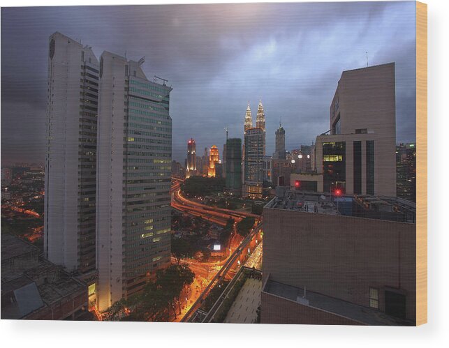 Thunderstorm Wood Print featuring the photograph Emerging Thunderstorm Over Kuala Lumpur by Shahin Olakara Photography