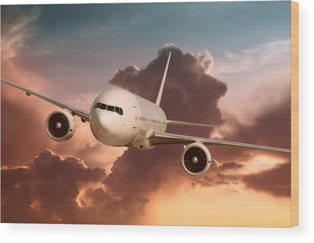 Outdoors Wood Print featuring the photograph Flying Passenger Airplane In Sunset by Narvikk
