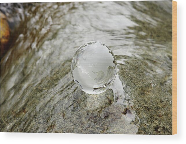 Environmental Conservation Wood Print featuring the photograph Glass Globe On The Water Stream by Sot