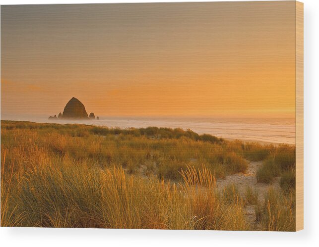 Sunset Wood Print featuring the photograph Haystack Rock by Ghyslain Heurtel