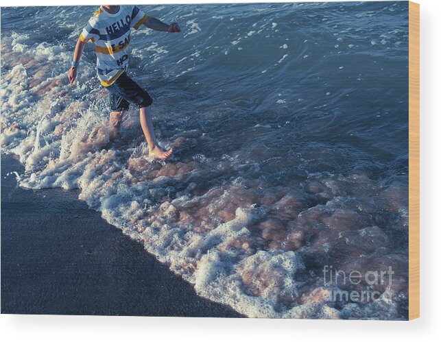 Active Wood Print featuring the photograph In summer children have to exercise outdoors and go out to sea t by Joaquin Corbalan
