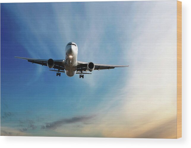 Dawn Wood Print featuring the photograph Jet Airplane Landing At Dusk by Sharply done