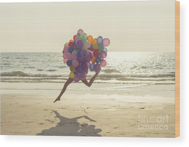 Child Wood Print featuring the photograph Jumping Girl With Balloons by Vizerskaya
