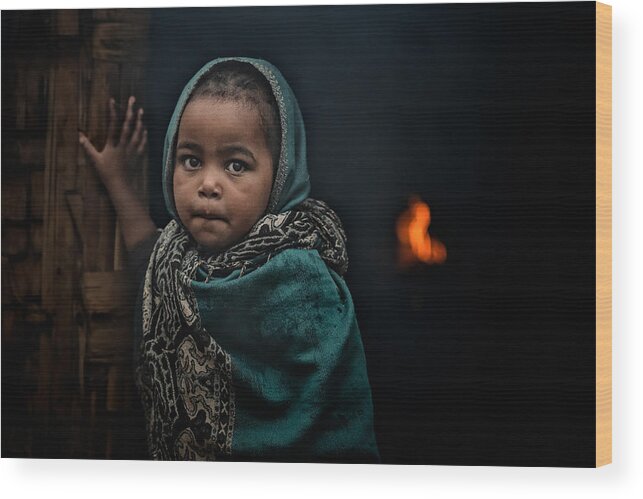 Little-girl-at-the-door---fires-burn-inside-the-house-in-the-dorze-tribe Wood Print featuring the photograph Little-girl-at-the-door---fires-burn-inside-the-house-in-the-dorze-tribe by Veli Aydogdu
