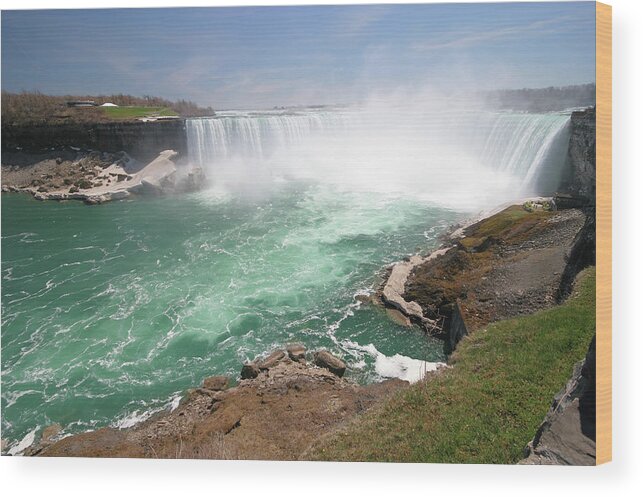 Water's Edge Wood Print featuring the photograph Magnificient Niagara Falls by Buzbuzzer